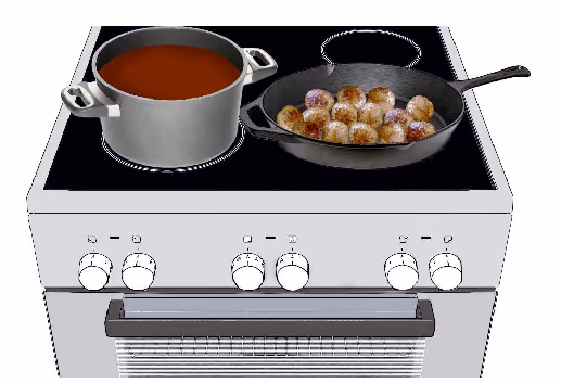 Komfyr med gryte med saus og stekepanne med kjøttboller